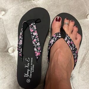 Black, super comfy flip-flops with fabric floral print strap